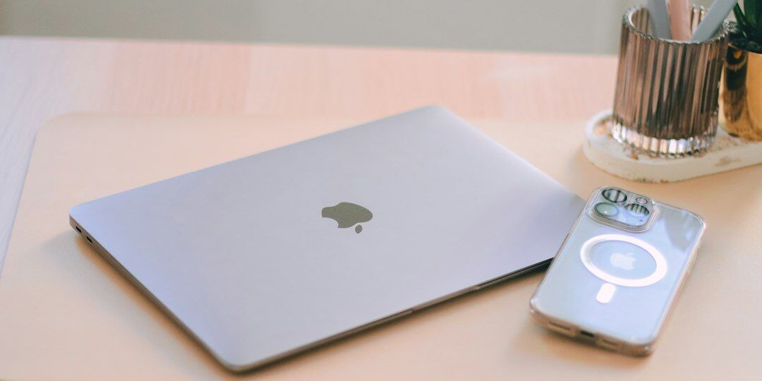 Desk with financial documents, a magnifying glass and a laptop used for investigative research